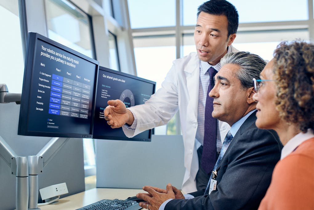 Instructor showing graphic of maturity model on screen