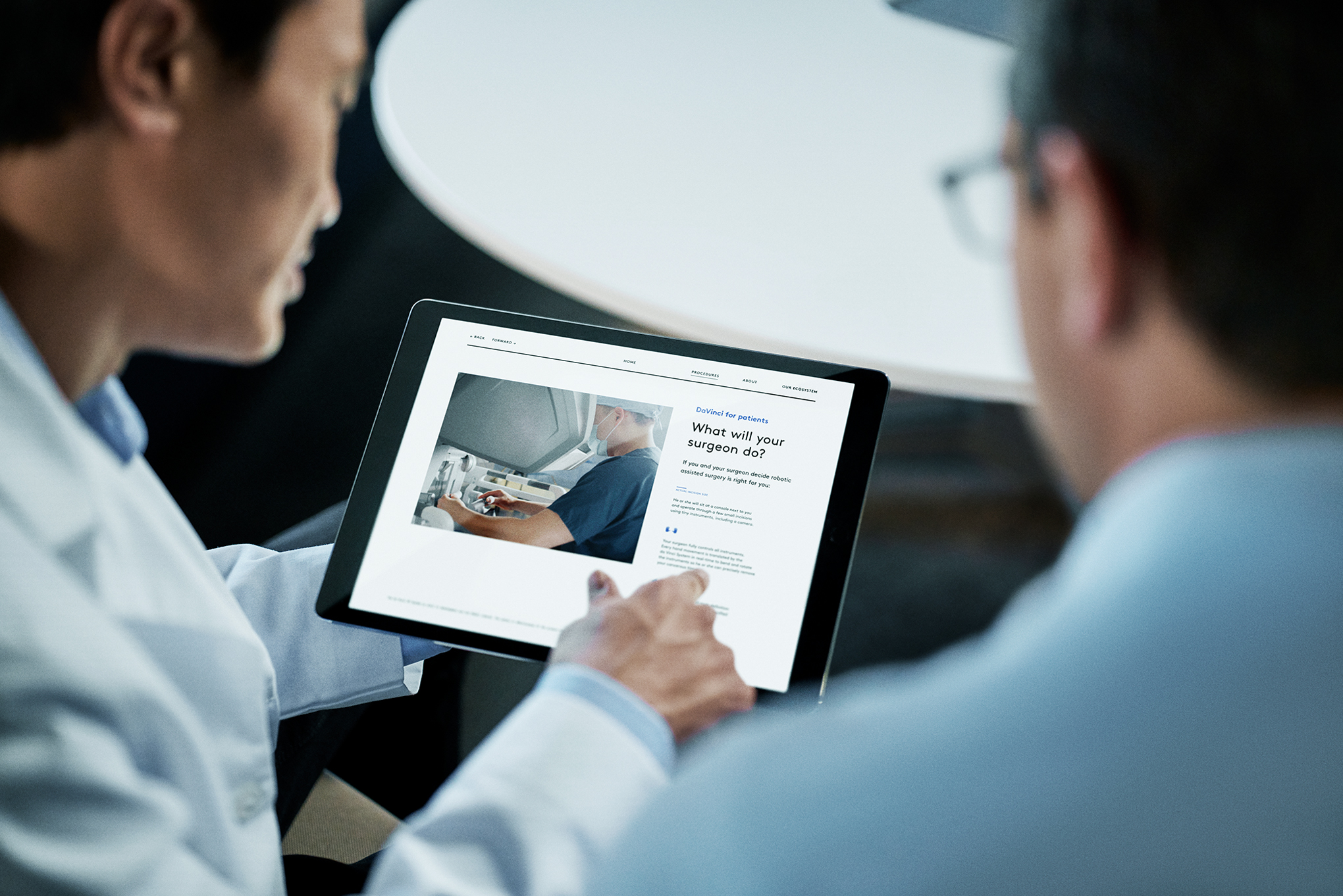Doctor sharing information on a tablet with a patient