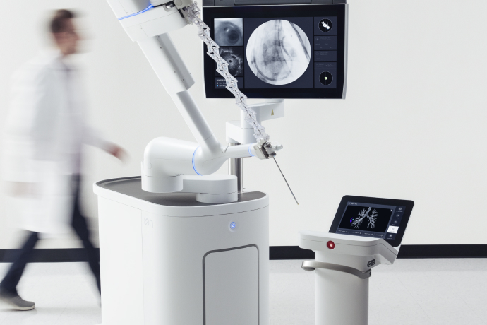 Physician walking near the Ion bronchoscopy system