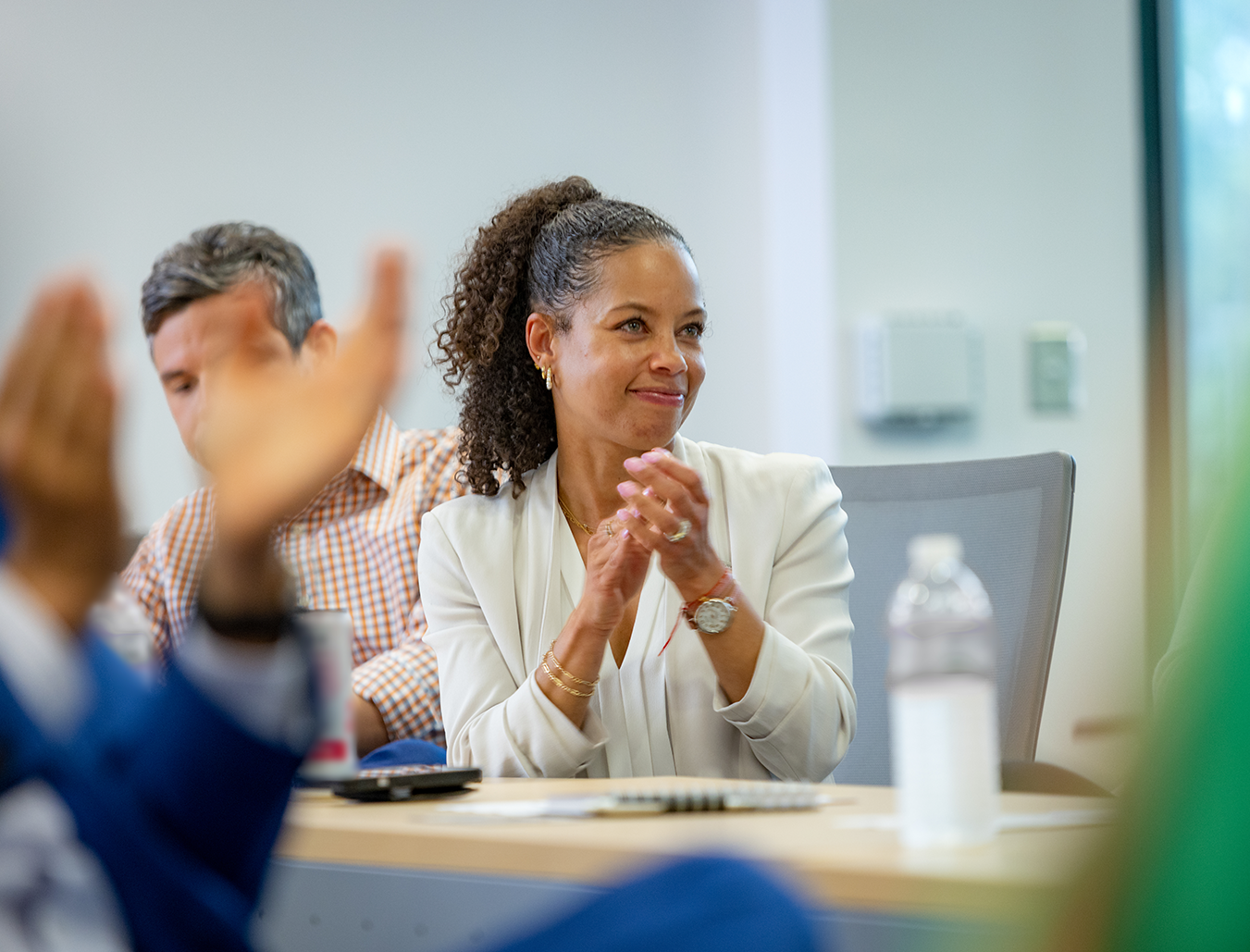 Smiling employee sitting in chair