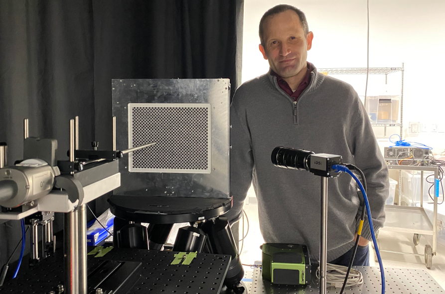 Image of Jeffrey DiCarlo, Vice President, Advanced Imaging, testing an endoscope for lens distortion.