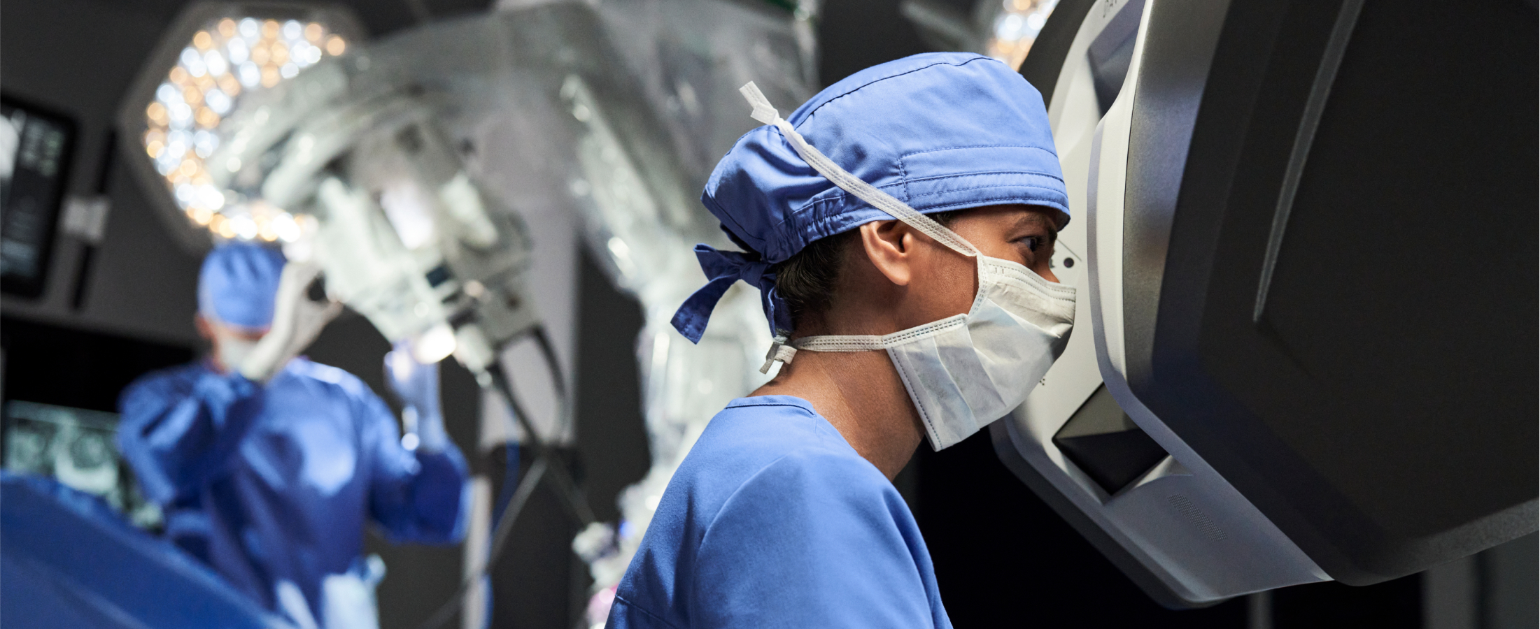 Surgeon looking into Intuitive da Vinci console