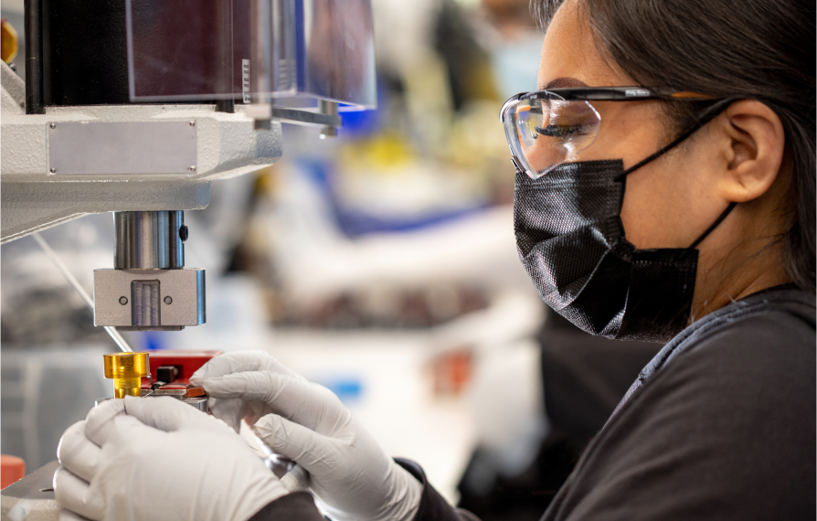 Female manufacturing technician working on instrument assembly in the Sunnyvale facility.