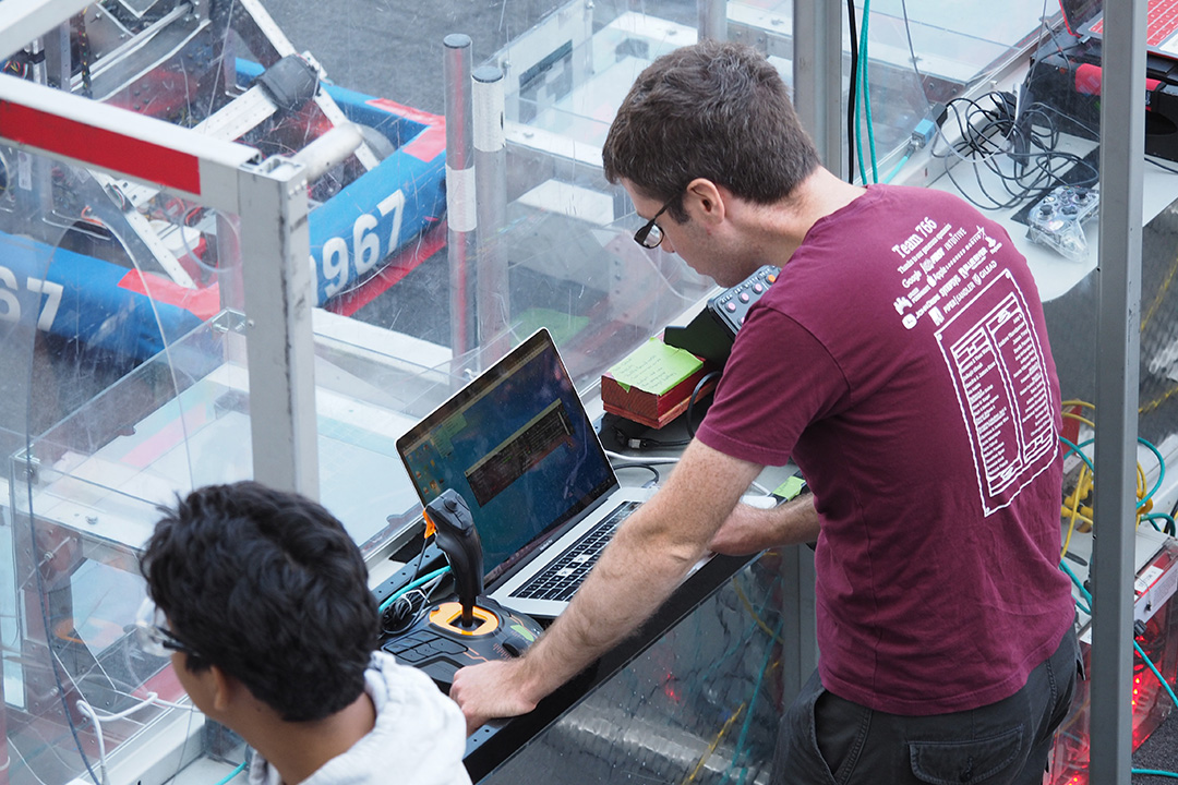 Robonanza student on computer in robotics competition