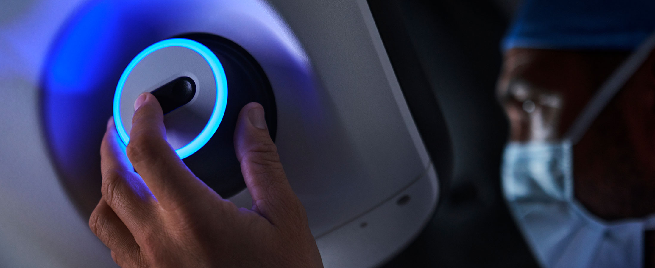 Surgeon using da Vinci 5 surgeon console